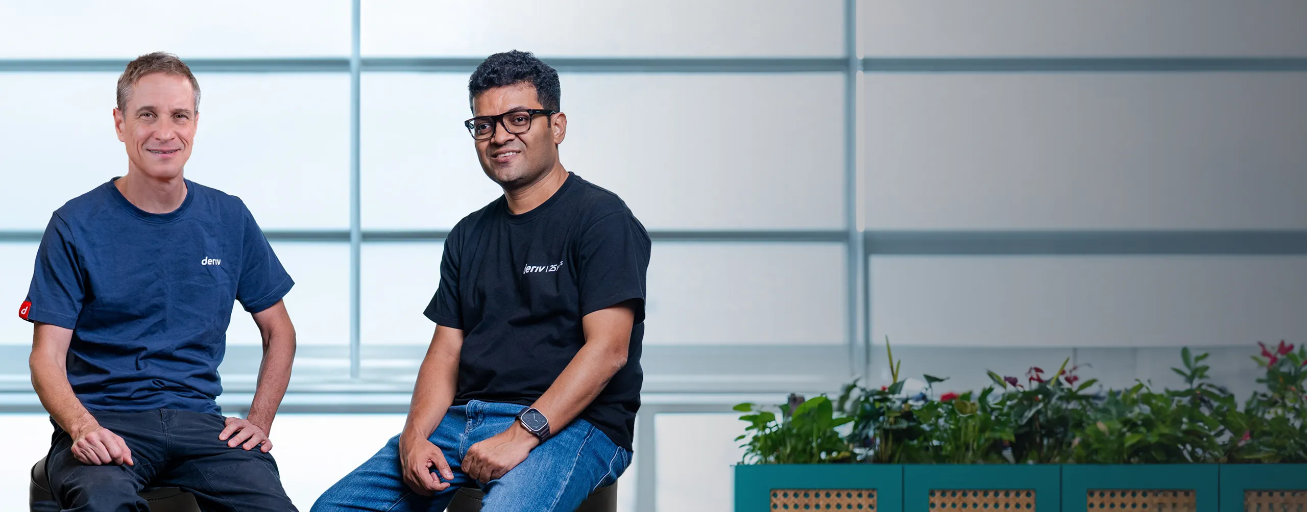 Deriv's CEO and Co-CEO seated together, highlighting their leadership and vision for advancing the company's innovation through AI technologies.